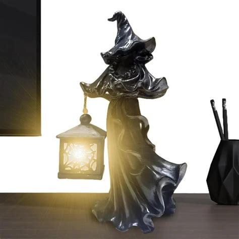Witch holding a lantern decoration for halloween at cracker barrel